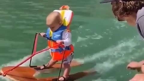 Brave boy cute loving waterskiing