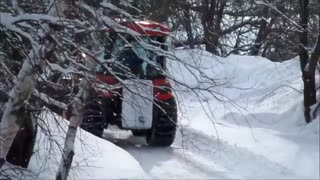 Kioti tractor plowing snow