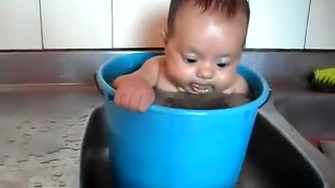 Funny bathrom of baby is 1 water barrel