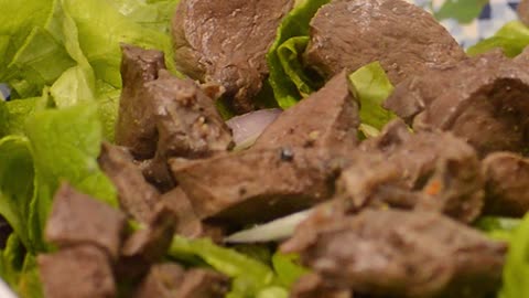 Boiled liver on lettuce leaves - Footage By Peakring.com