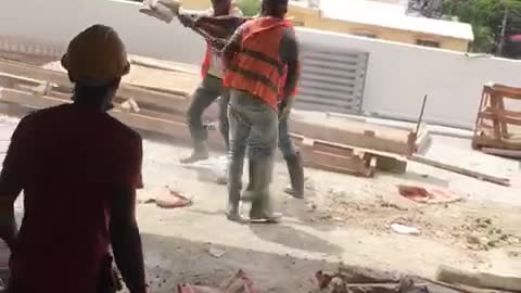 masons disagree and one hits the other with the shovel