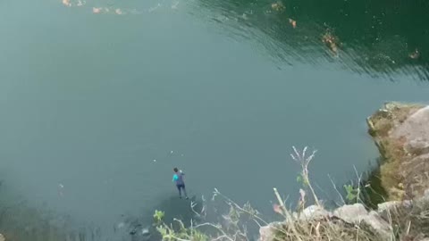 Jumping from a high place in the sea