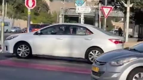 Two terrorists arrive this morning at a bus stop in the center of Jerusalem