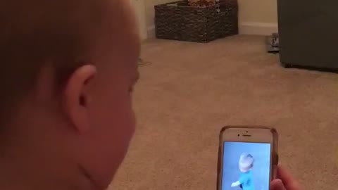 Baby laughing at video of himself