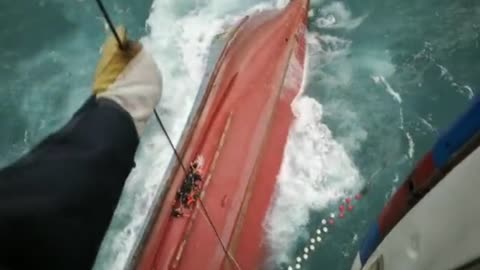 Dramatic Air-Sea Rescue Of Crew Adrift On Capsized Ship