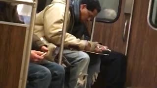 Man smoking and drawing on train