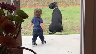 Mom catches toddler adorably walking out just to give dog a big hug