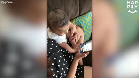 Baby Entertained By Laughing