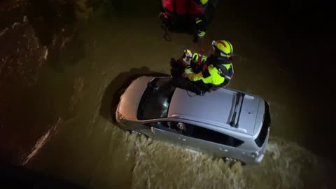 Firefighters Rescue Man Trapped in Car During Flood