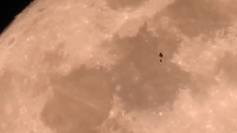 What is this Balloon Looking Object flying in Front of the Moon? (found on telegram)