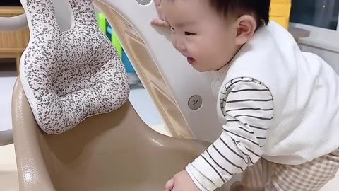 Cute Baby Learning How To Sit Down