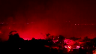 Raging wildfire lights night sky in California