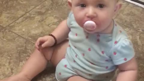 Baby stands up for the first time at only six months old