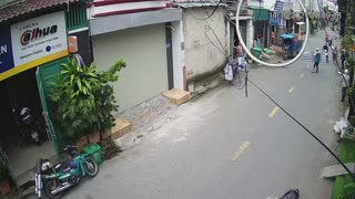 Motorcyclist Nearly Hit by Falling Piece of Roof