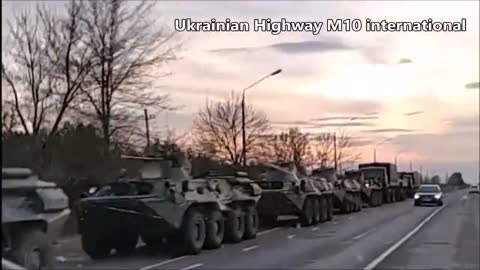 A Column Of Russian Military Vehicles Retreat Moving Towards Russia With No Cabin