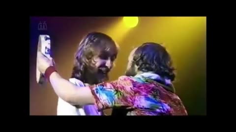 Phil Collins Hitting Mike Rutherford With Tambourine