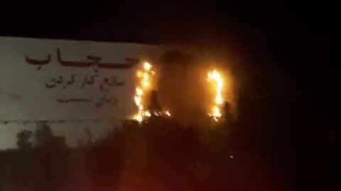 Iranian people set the pro muslim billboard on fire
