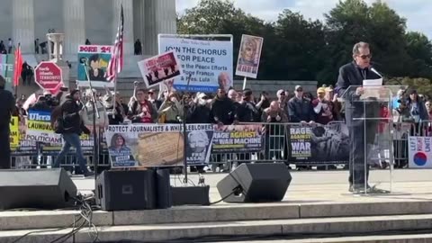 Crowd erupts as a balloon is spotted as Jimmy Dore started his speech at the rage against the war machine rally at the capital