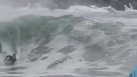 More Wild Surfing on the Hurricane with powerfull waves knocking people over.