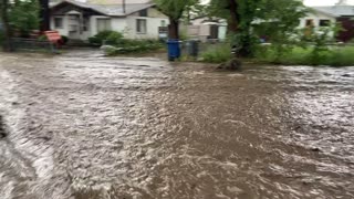 Flash Flooding Sends Coach Floating Down the Street
