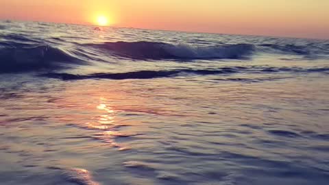 Slow motion waves at Sunset