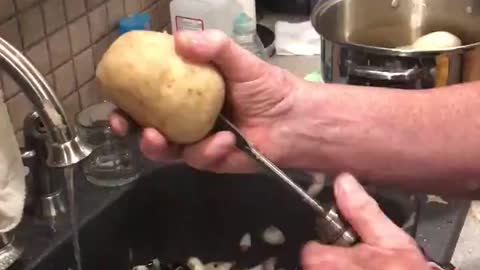 Peeling potatoes with a drill.