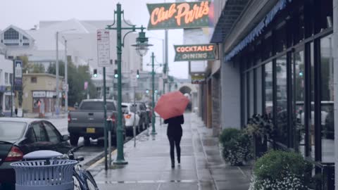 Street Rainy Walking With Orange Umbrella