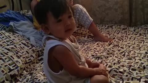 cutie baby playing on the bed