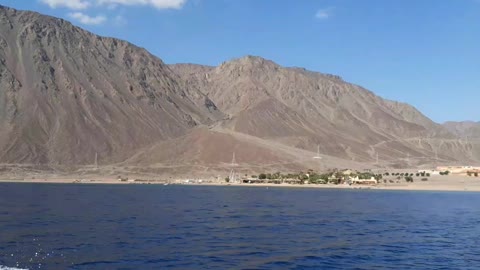 Speedboat walking near hills