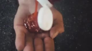 Black shirt guy eats gross ketchup out of his hand