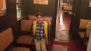 Spencer on an antique subway at the Transit Museum VID 20191019 135205