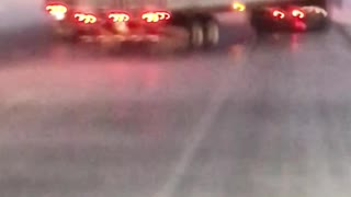 Wind Whips Trailer into Passing Truck