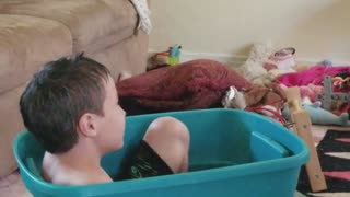 Capuchin Monkey Grooms Kid's Hair and Plays in the Toy Tub With Him
