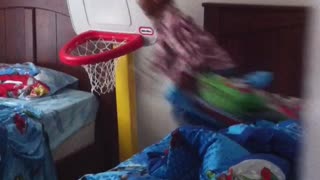 Little kid tries to jump from blue bed to blue bed but hits chin