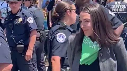 AOC Fakes being Handcuffed after Arrest
