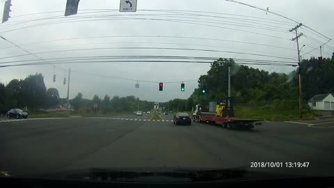 Collision is avoided after car pulls onto busy highway