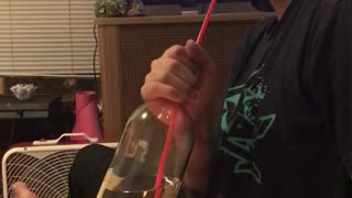 Guy puts fire under wine and then breathes out smoke