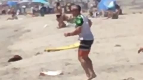 Full kookin man spins on beach