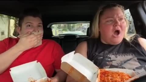 People are staring at them eating in the car