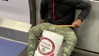 Subway train bucket drum singing duo