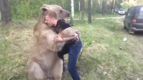 Russian guy plays with bear l