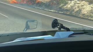 Truck Fire Spreads Along Shoulder
