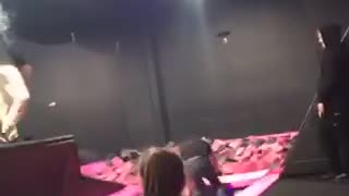 Guy jeans black shirt tries to trampoline jump into pink foam pit fail
