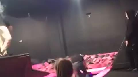 Guy jeans black shirt tries to trampoline jump into pink foam pit fail