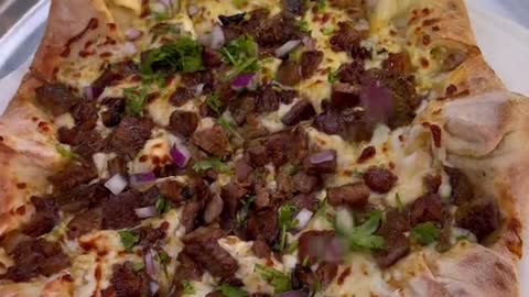 Would you eat this cheesy Carne Asada Pizza Got this delicious pizza from