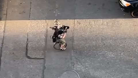 Unicycling Villain Plays Fire-Spitting Bagpipes