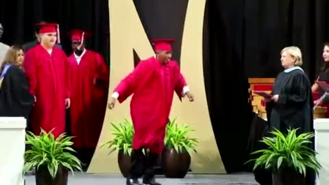 Graduate does backflip on stage