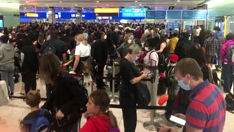 Holidaymakers return to Heathrow airport's travel chaos