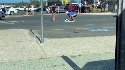 Guy Rescues a Small Penguin in the Middle a Road