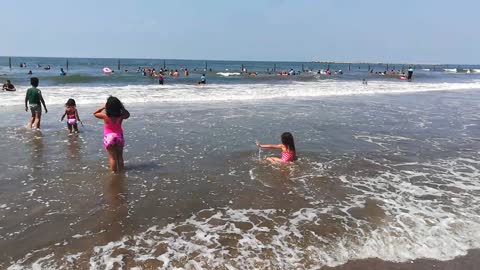 Girls Play On Ras El Bar Beach Blue Water